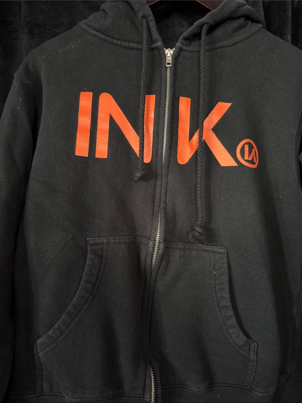 INK Women's Black Zip-Up Hoodie with Orange Logo